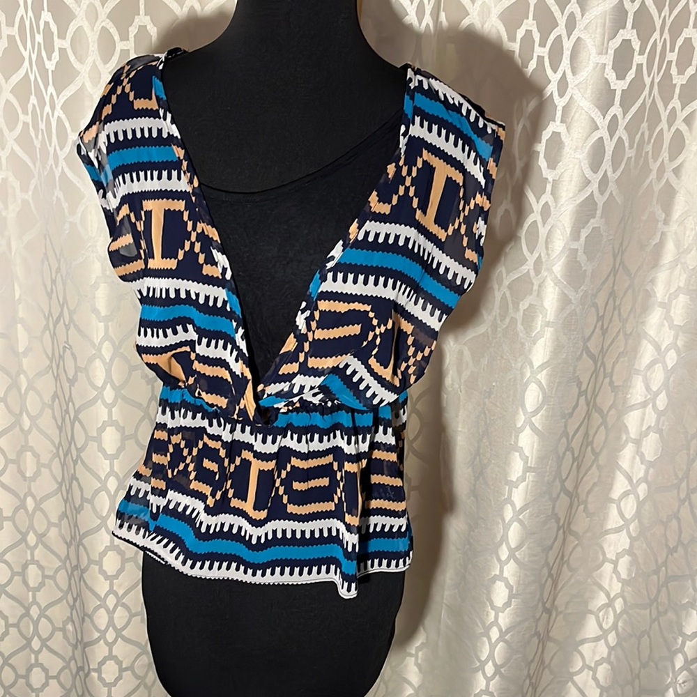 Papaya women’s top size M. Thinner outer material w pattern and black under